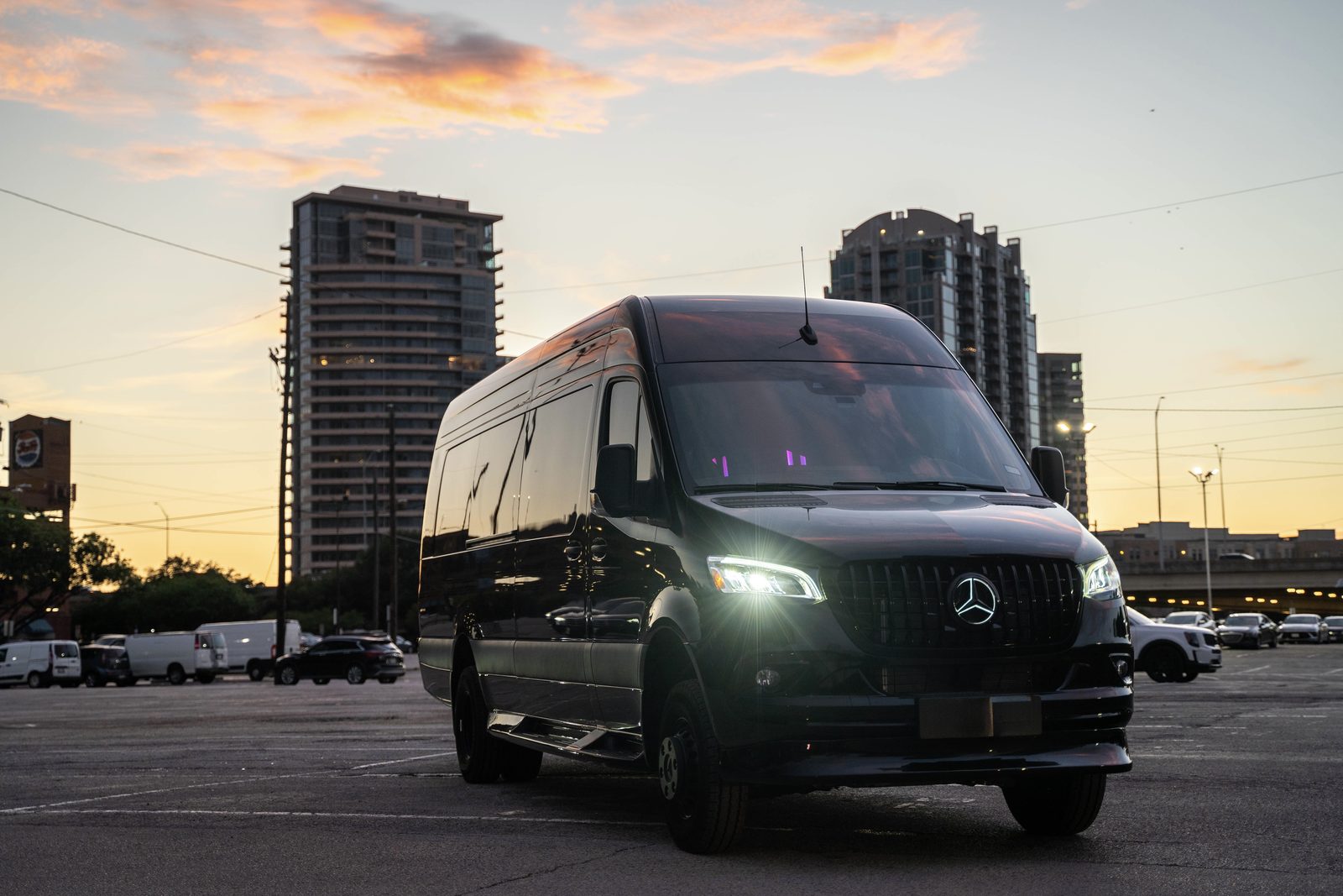 Black Sprinter parked at sunset, ready for a one-way ride