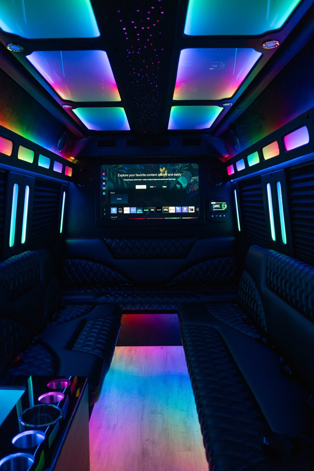 Wide view of Limo Sprinter cabin with color-changing lights and display