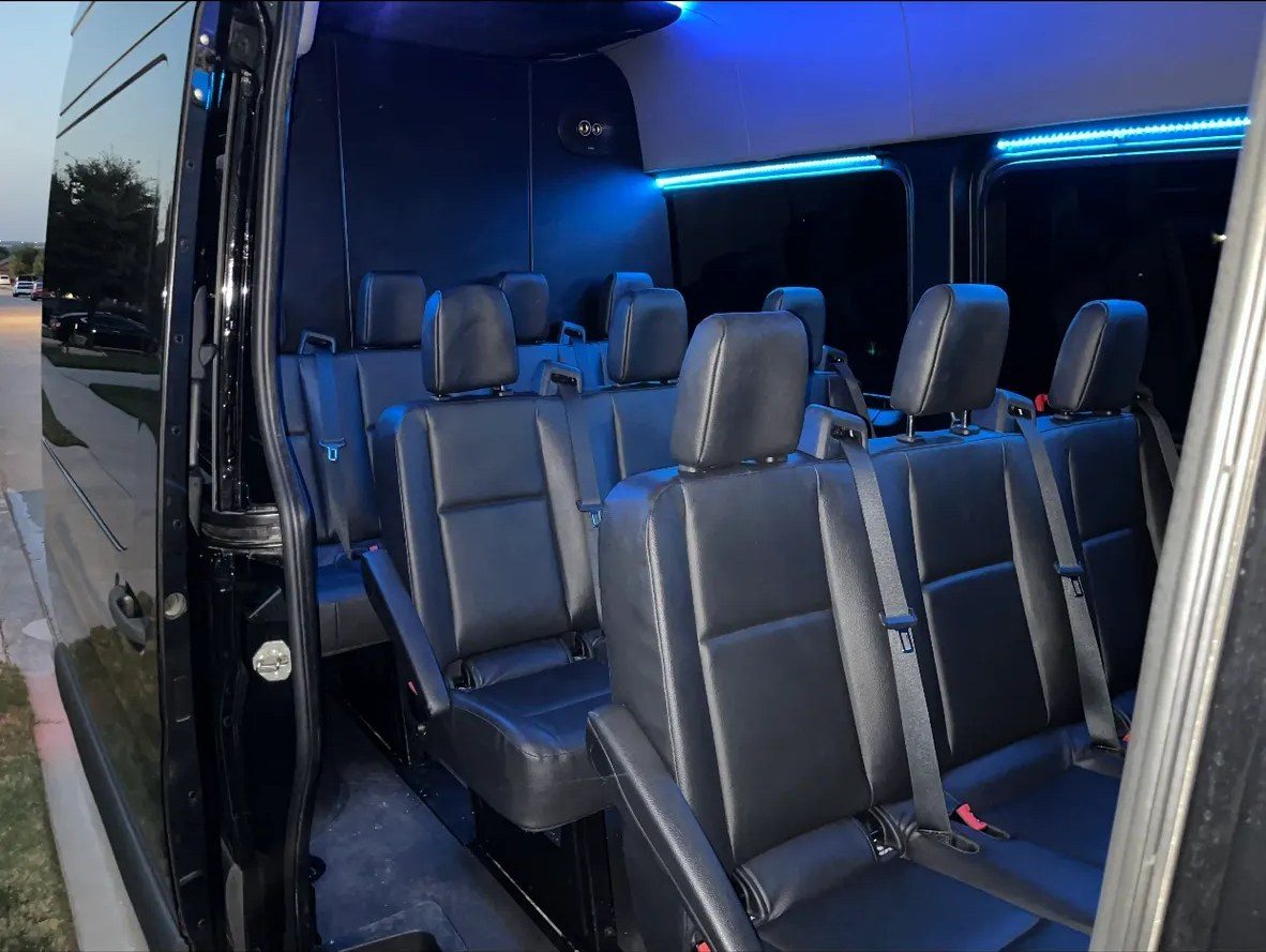 Passenger Sprinter interior with blue accent lighting and leather seats